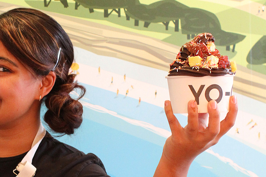 Yo-Chi - Girl holding chocolate frozen yogurt