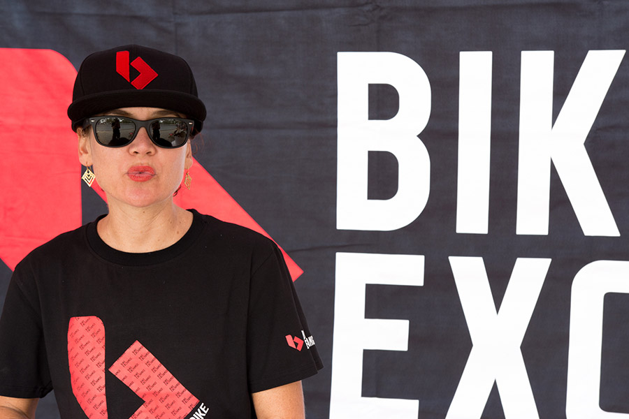 Bike Exchange Image with lady with red lipstick and full support uniform