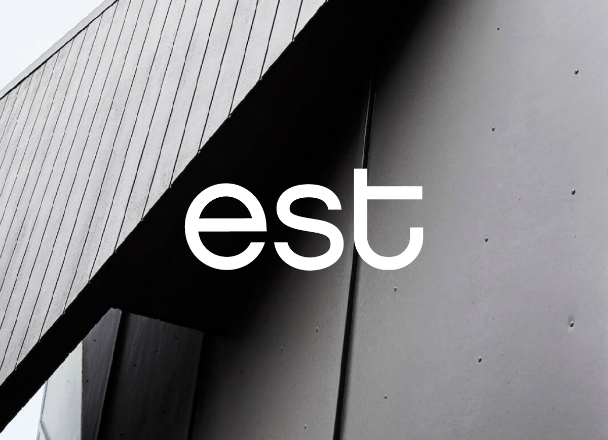 est brand mark over a timber and metal architectural image